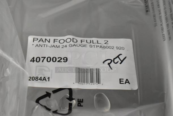 5 new scratch and dent stainless steel steam table pans, Choice model 4070029, anti-jam, 24 gauge, full size, tags visible.