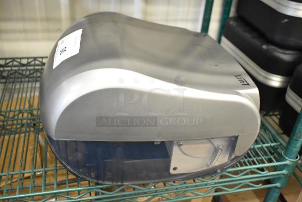 Brand new Lavex poly wall-mounted paper towel dispenser with slight scratches. Durable build, easy installation design.