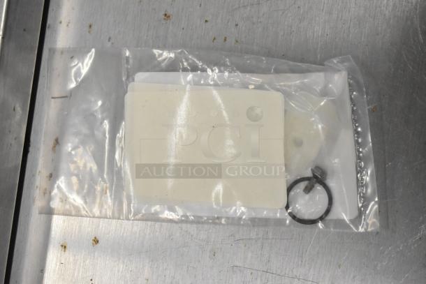 Five new Hobart 00-893535 rinse nozzles, in original packaging, showing minor scratches and dents. Includes fasteners.