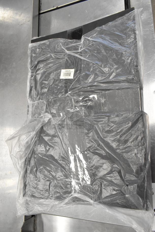 4 brand new Choice 12"x18" black bar mats, model 723BMATBK, in original packaging with minor dents visible.