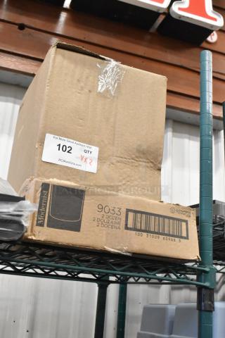 Cardboard boxes labeled "Modernist" and "Reserve" on shelf. Contains 500GBWL750C wine bottles, Reserve 7 oz. glasses. Tags show "102 QTY x2".