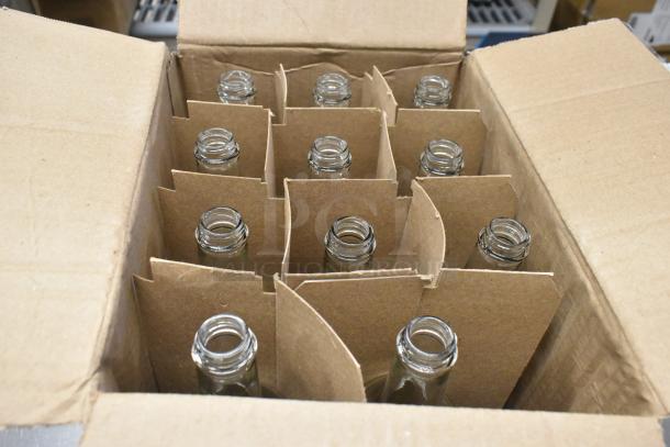 Box of 750 mL glass Bordeaux wine bottles, brand new, scratch and dent condition, in cardboard dividers.