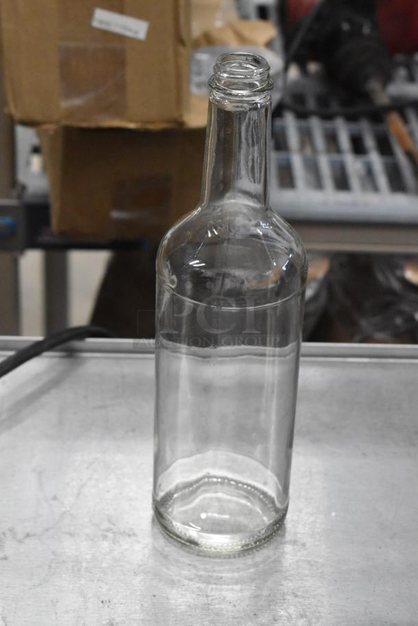 Clear 750 mL glass Bordeaux wine bottle, new condition, no labels, suitable for wine storage or decoration.