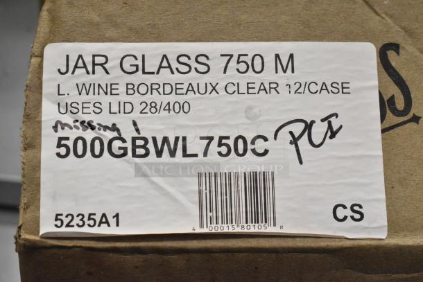 Label on a cardboard box showing "Jar Glass 750 M, Bordeaux Clear, 500GBWL750C." Contains scratches and hand-written markings.