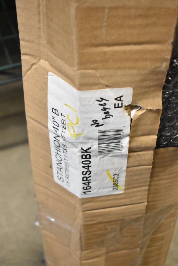 BRAND NEW SCRATCH AND DENT! Lancaster 40" black stanchion with 10' retractable belt, model 164RS40BK, in damaged packaging.