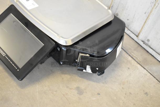 2017 Hobart HTi-7LH26 commercial scale, silver platform, black base, touchscreen, 120/208-240V, 1 phase, used condition.