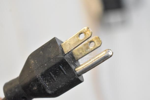 Close-up of a plug from the 2017 Hobart HTi-7LH26 commercial countertop scale, showing a 3-prong design.