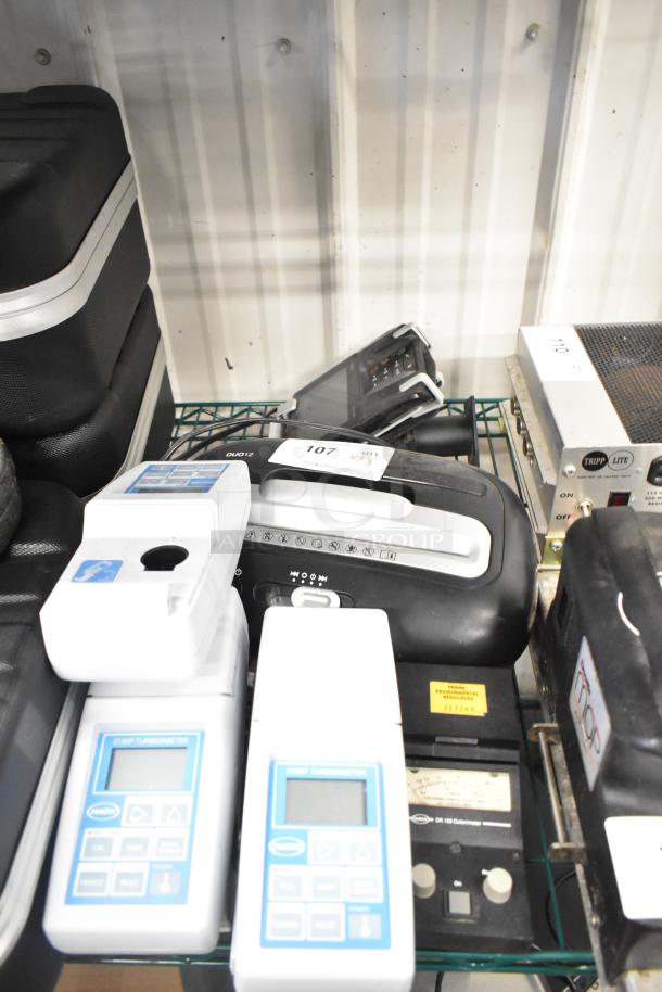 Assorted items include Hach 2100P turbidimeter, EC20 meters, Swingline shredder, DR100 colorimeter, Ingenico card reader.