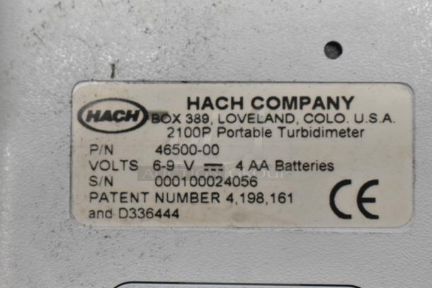 Hach 2100P Turbidimeter label showing model and voltage details, requires 4 AA batteries.