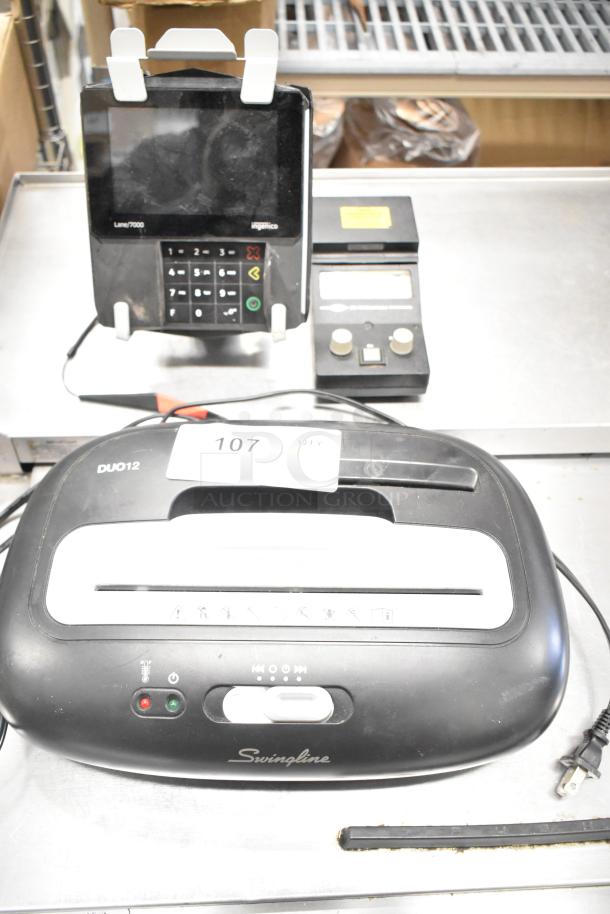 Eight mixed items including Hach 2100P turbidimeter, Hach EC20 meters, Swingline paper shredder, Hach DR100 colorimeter, Ingenico card reader.