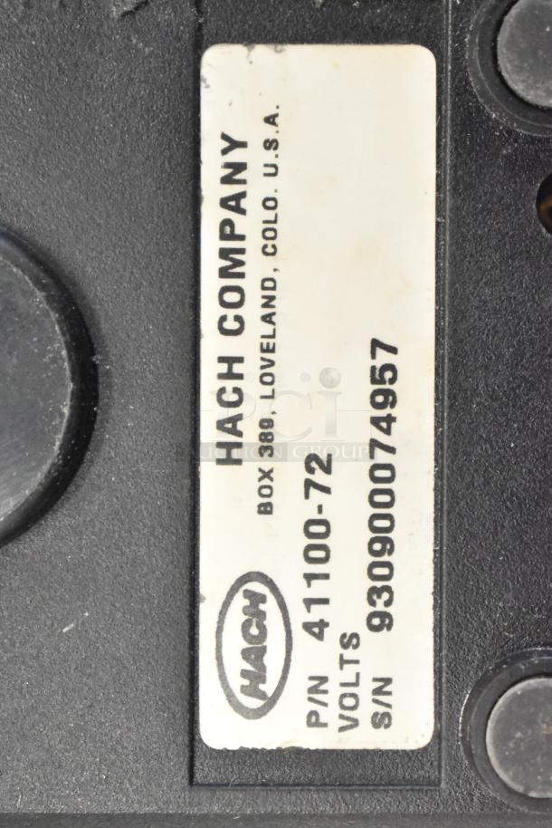 Hach Company label with P/N 41100-72 and S/N 930900074957 visible, indicating a Hach device part.