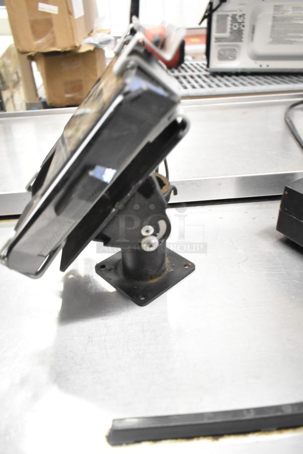 Ingenico card reader on adjustable stand, slight wear visible, part of an 8-item auction lot, including Hach and Swingline devices.