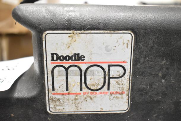 Doodlemop 36 VDC Scrub Battery with visible label and signs of wear. Label reads "Doodle Mop by Square Scrub."