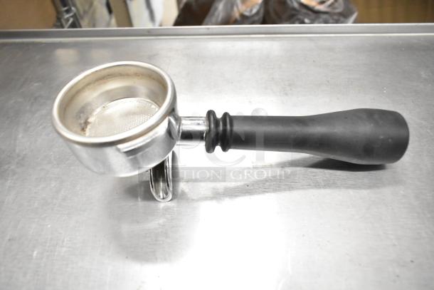 Single portafilter with black handle, metal basket, lightly used. Includes three units in this auction lot.