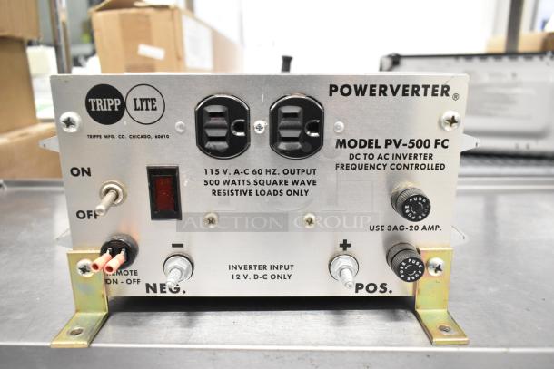Tripp Lite PV-500 FC Powerverter; metal casing, 115V, 1-phase, 500W output; features switch, inputs, and labeled connections.