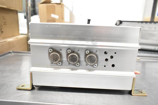 Tripp Lite PV-500 FC Metal Powerverter, 115 Volts, 1 Phase, with three visible connectors, silver casing.