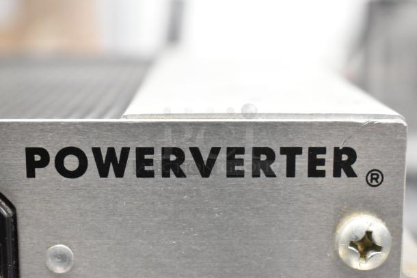 Tripp Lite PV-500 FC Powerverter, metal casing, 115 volts, 1 phase, visible logo, minor surface markings.