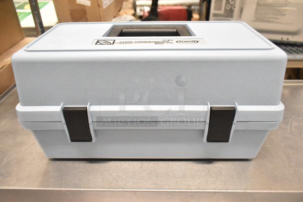Empty Hach 2100P turbidimeter hard case, gray, with handle and secure latches. Suitable for protecting equipment.