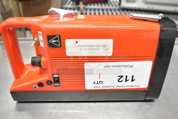 UVP UVSL-26P rechargeable UV lamp, red casing, 115 volts, 1 phase. Features handle, switch, and visible property label.