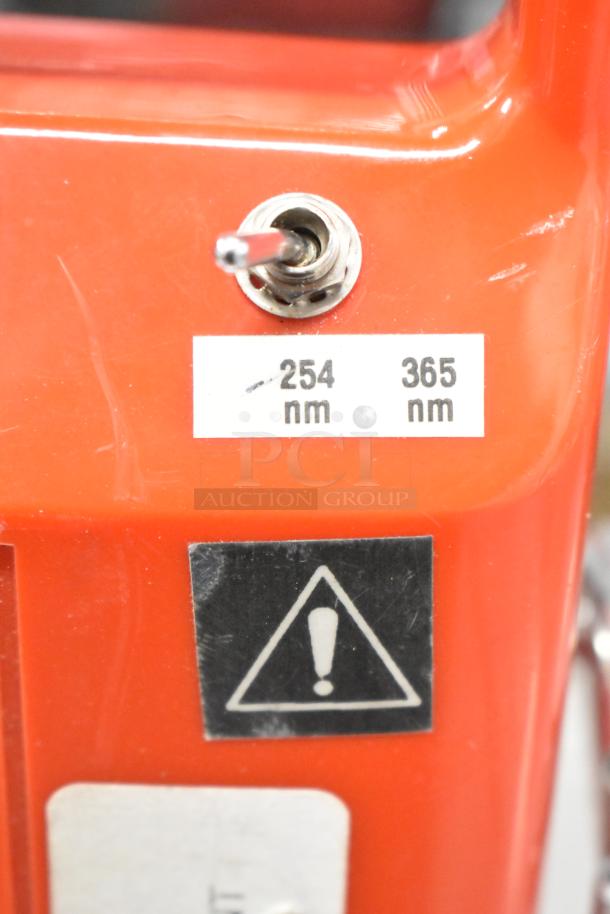 UVP UVSL-26P Rechargeable UV Lamp with switch for 254 nm and 365 nm settings. Red casing, 115V, 1 Phase.