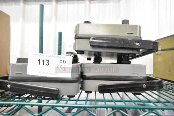 Three VSI Model 57 Oxygen Meters stacked; includes auction tag indicating quantity 3. Appears in used condition.