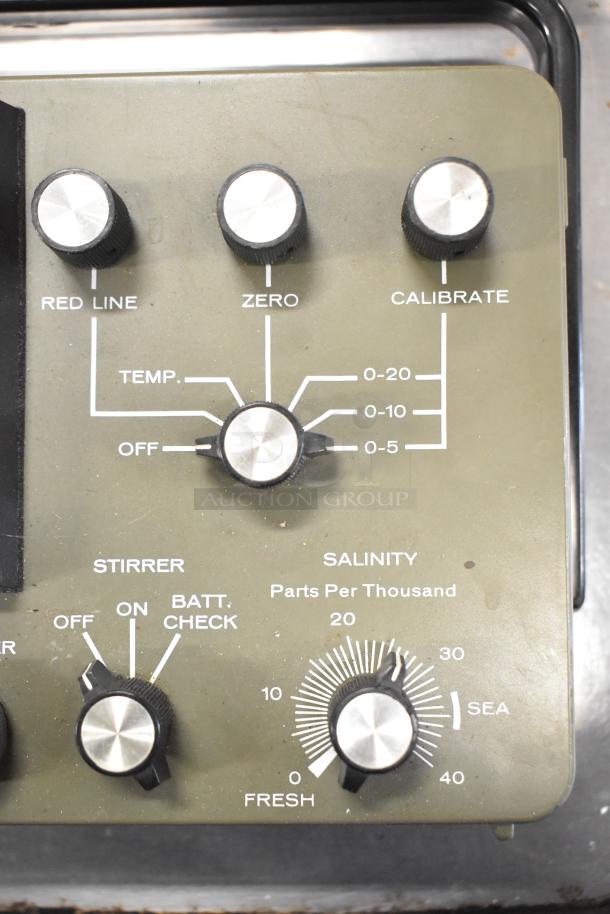 3 VSI Model 57 Oxygen Meter with dials for temperature, salinity, and calibration. Visible controls and labels indicate functionality.