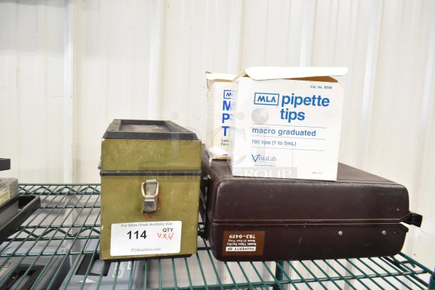 Four items including MLA pipette tips box, Leeds & Northrup specific ion meter in a metal case, and a brown briefcase.