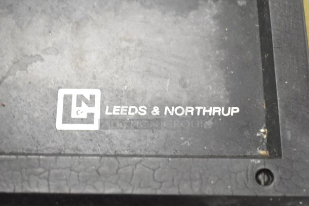 Leeds & Northrup specific ion meter panel with company logo, featuring signs of wear.
