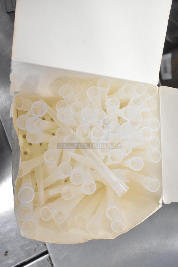 Box of pipette tips in new condition, part of a lot including Leeds & Northrup ion meter and briefcase.