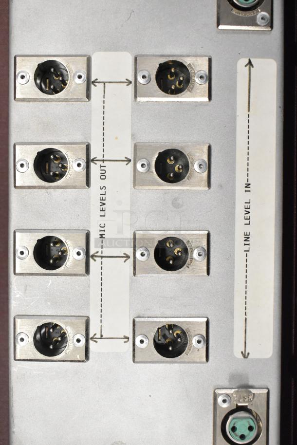 Audio equipment with multiple input/output connectors labeled "Mic Levels Out" and "Line Level In."