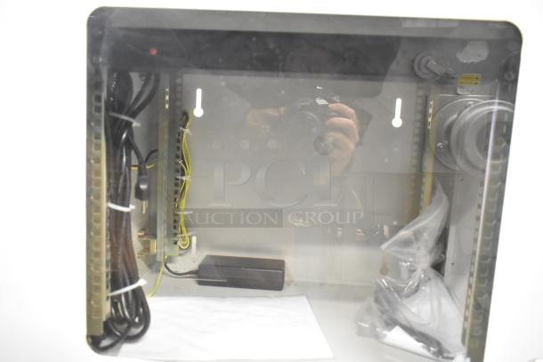 2 BlackShields DC0300 white metal air-conditioned technology cabinets. Features cables, wiring, and secure storage space.