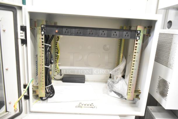 BlackShields DC0300 white metal air-conditioned technology cabinet, open view, showcasing power strip, wiring, and mounting hardware.