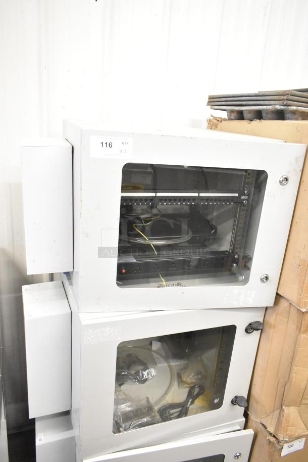 2 BlackShields DC0300 white metal air-conditioned tech cabinets with rack units, glass doors, visible cables, model label.