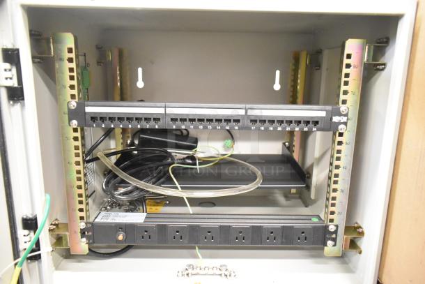 BlackShields DC0300 white metal technology cabinet with air conditioning, rack unit, cables, ports, and power strip inside.