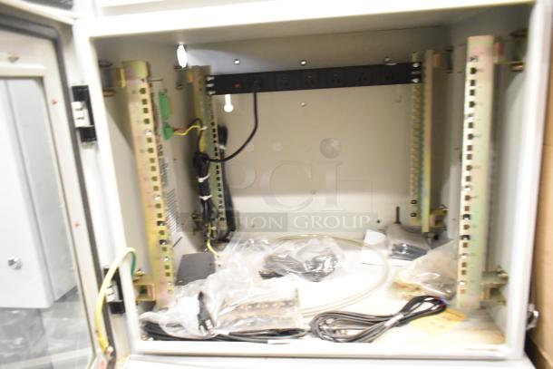 BlackShields DC0300 air-conditioned white metal technology cabinet with rack unit, visible wiring, and mounted power strip.