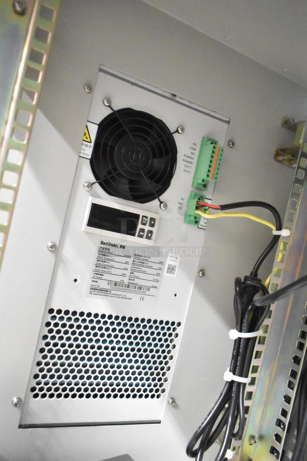 2 BlackShields DC0300 white metal air-conditioned tech cabinets with rack units, featuring fan and control panel.