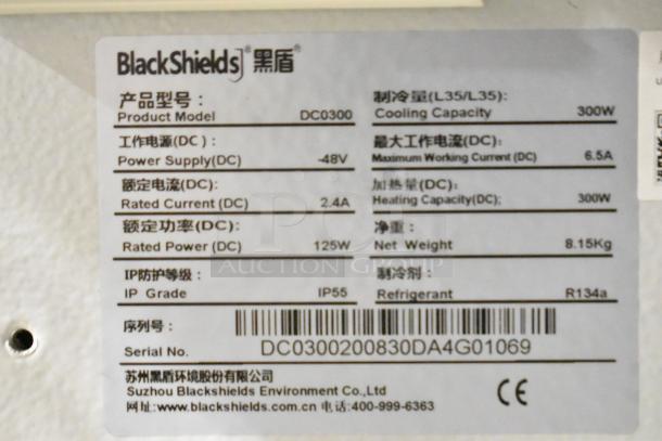 BlackShields DC0300 label with specs: 48V, 2.4A, IP55, R134a refrigerant, 300W cooling/heating, 8.15Kg weight. Serial: DC0300200830DA4G01069.