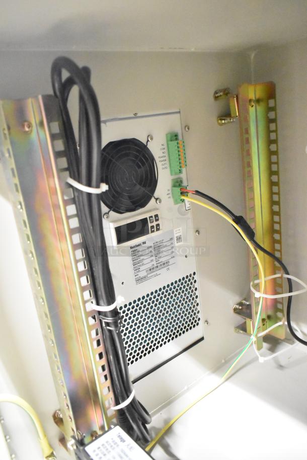 BRAND NEW BlackShields DC0300 white metal air-conditioned tech cabinet, minor scratches, internal wiring and control panel visible.