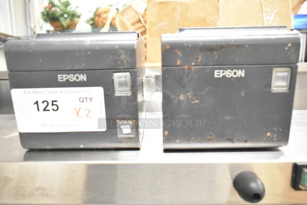 Two Epson M313A receipt printers with visible wear and rust. Label marked "125 QTY X2" from PCIAuctions.com.