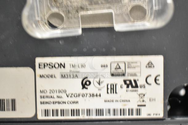Epson M313A receipt printer label showing model, serial number VZGF073844, and manufacturing details.