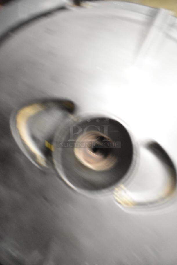 Blurry image, unclear details, possibly a part of a Bunn SH SERVER coffee satellite server.