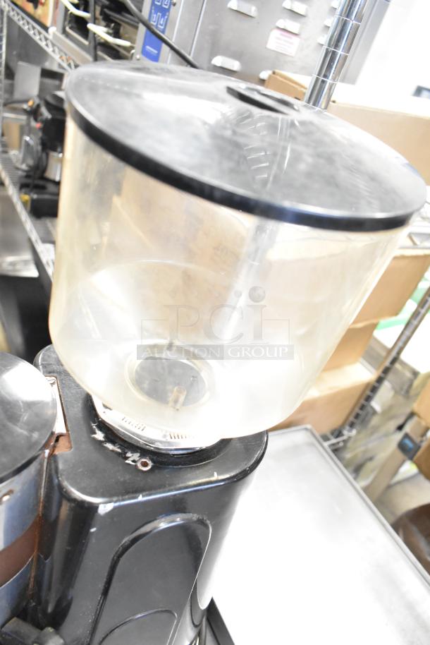 Metal commercial countertop espresso bean grinder, 115 volts, 1 phase, in good condition with transparent bean hopper.