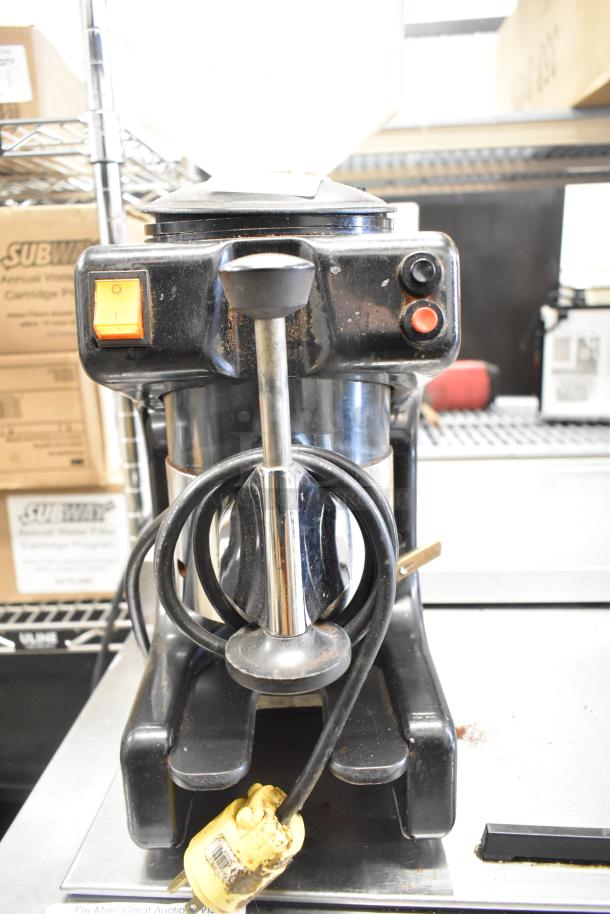 Metal commercial countertop espresso bean grinder, 115 volts, 1 phase, black, visible control buttons, slightly worn.