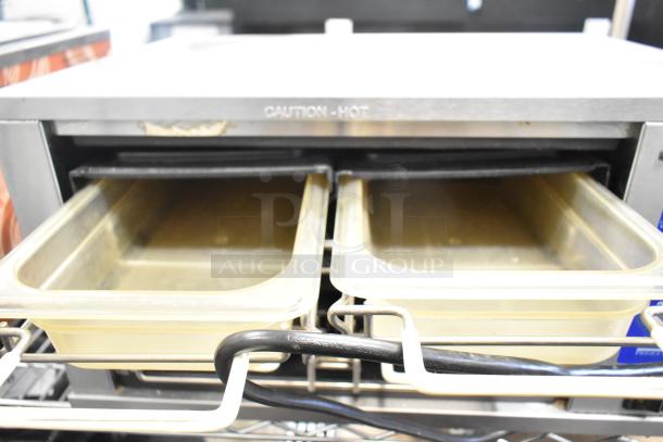 Prince Castle DHB-DDB stainless steel holding bin, dual compartments, countertop model, 120V, with "Caution - Hot" label.