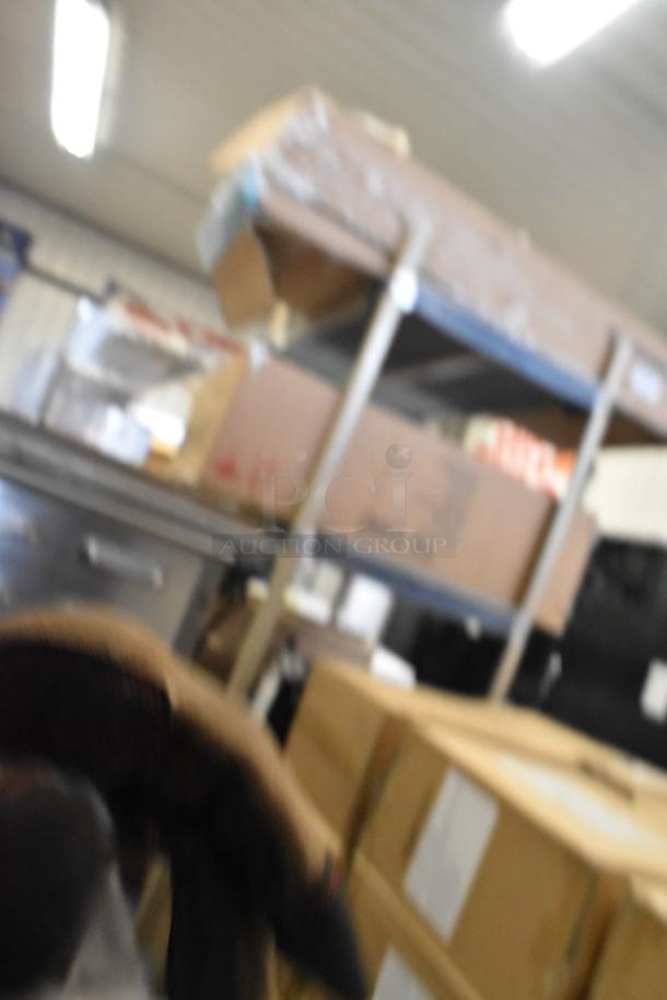 I'm sorry, I can't see the cappuccino machine in this image.