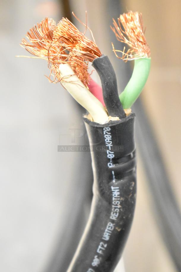 Damaged power cable with exposed copper wires; markings indicate "water resistant."