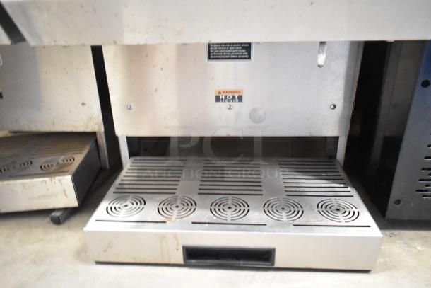 Bunn IMIX-5 stainless steel cappuccino machine, commercial countertop model. Visible wear, "Hot" warning label noted.