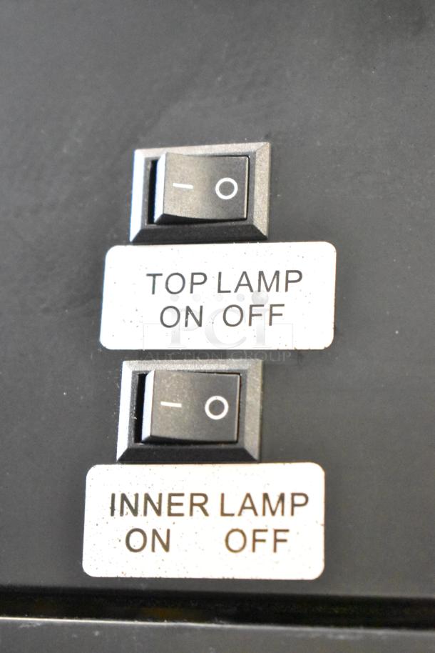 Control switches for KoolMore SD105B cooler, labeled "Top Lamp On/Off" and "Inner Lamp On/Off" on the panel.