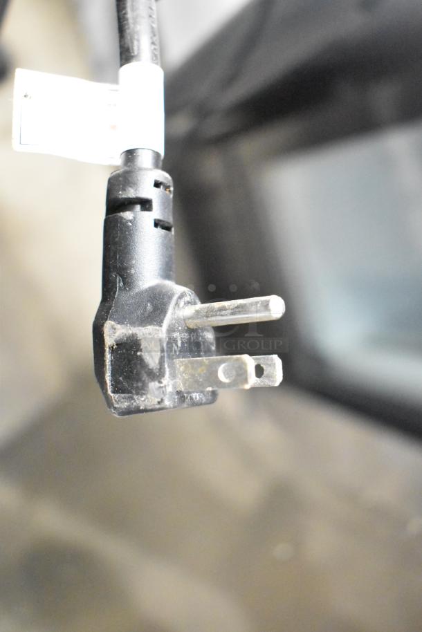 Close-up of the power plug from a Kool-It KBSR-1 commercial reach-in cooler, 115 volts, 1 phase.