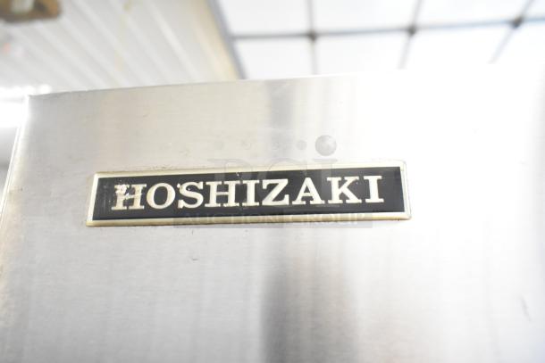 Hoshizaki KM-1300SRH ice head on ice bin, stainless steel, 208-230V, 1 phase, commercial use. Branding visible.